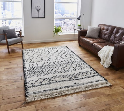 Bohemian black and cream rug with tassels