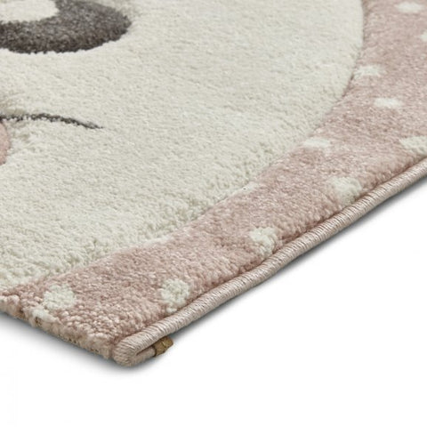 Bunny nursery rug in pink close up edging